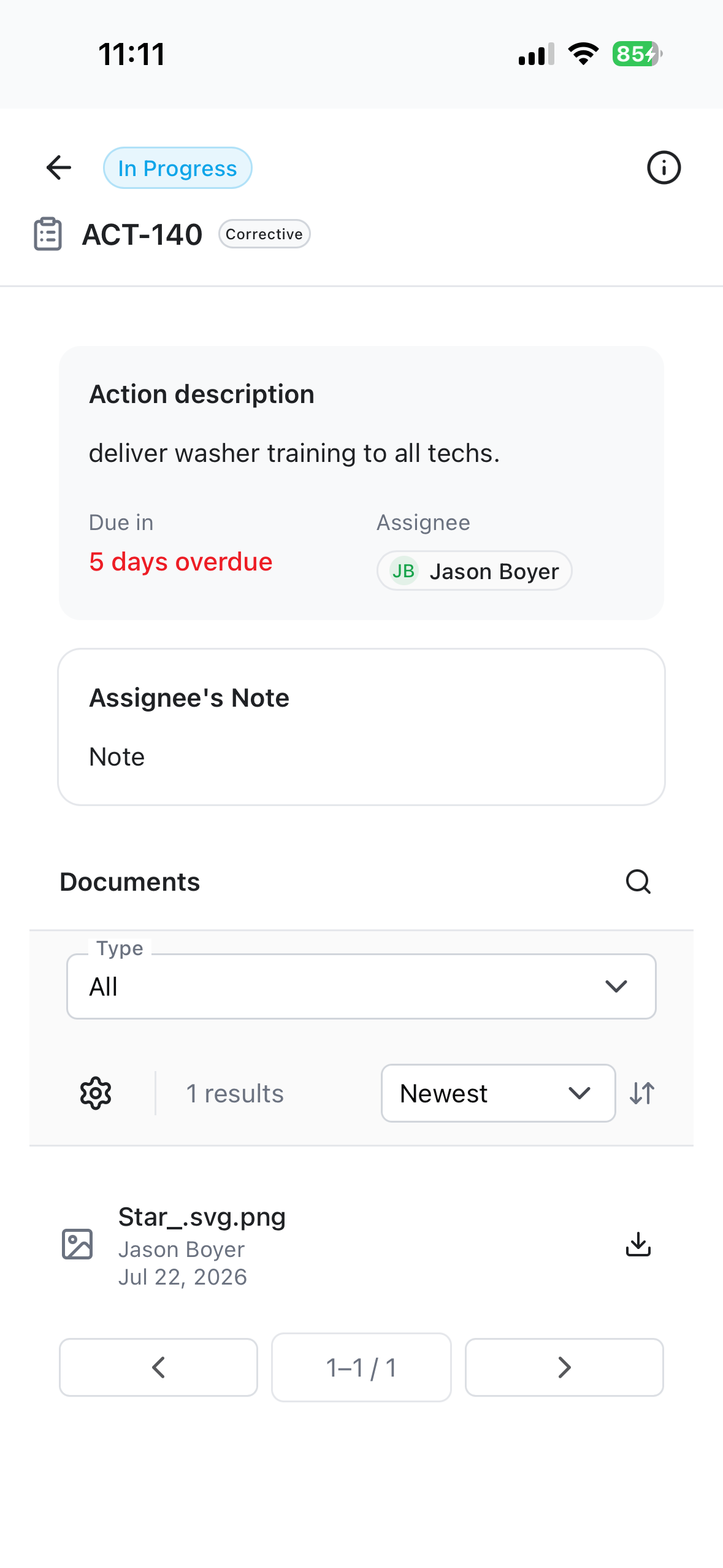 An action item with the assignee's note and an attached photo